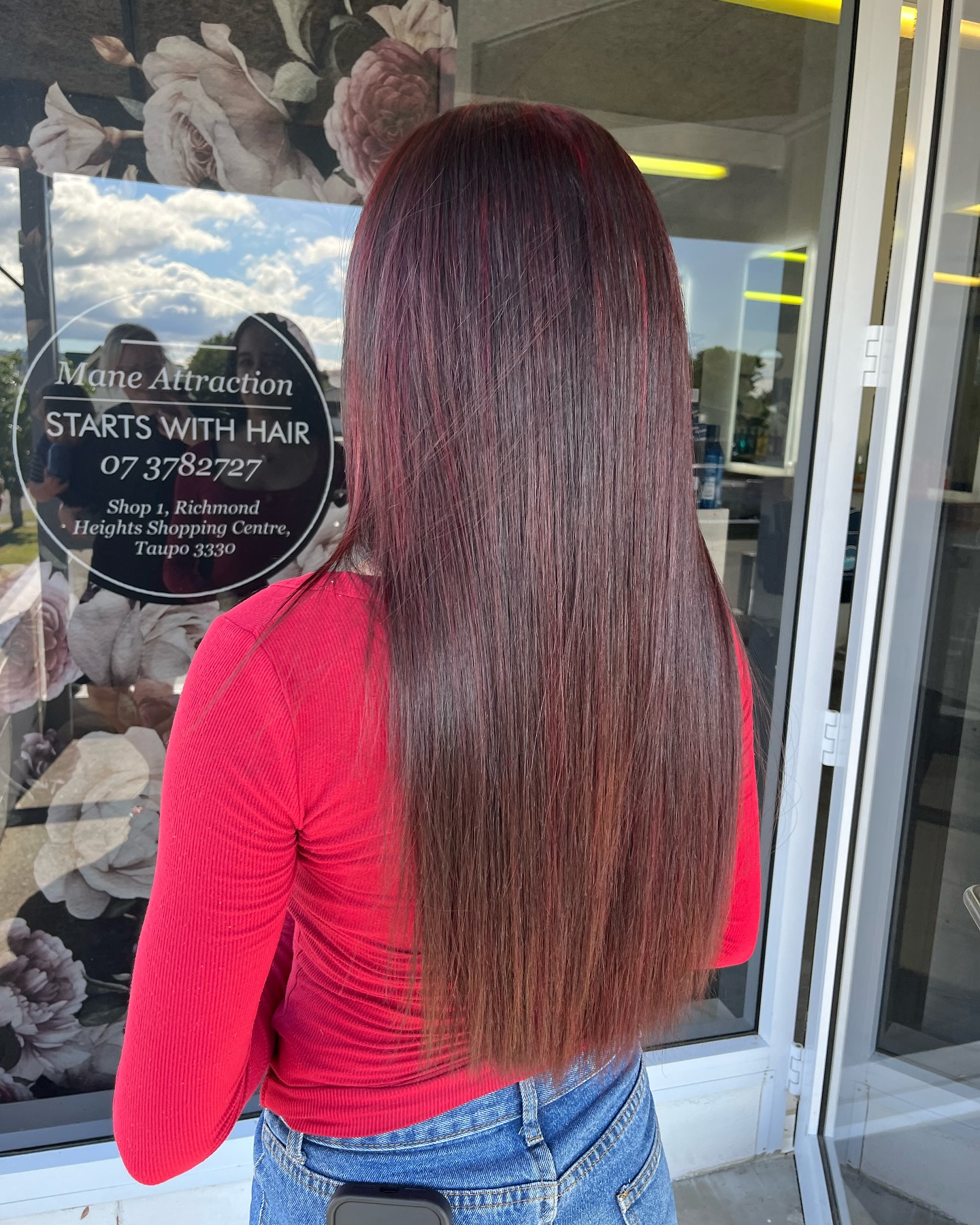 Rich red colour finished at Mane Attraction, shot at the Taupō shopfront